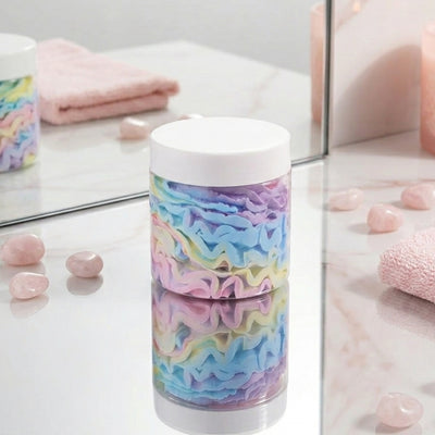 Colorful tumbler with a white lid on a reflective surface